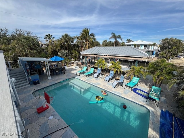 view of swimming pool featuring a patio