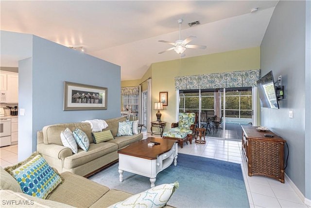 tiled living room featuring ceiling fan and vaulted ceiling