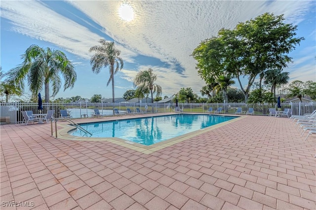 view of swimming pool featuring a patio area