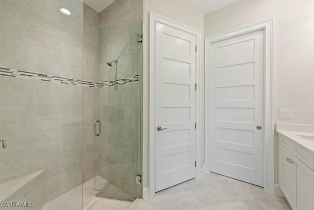 bathroom with vanity and an enclosed shower