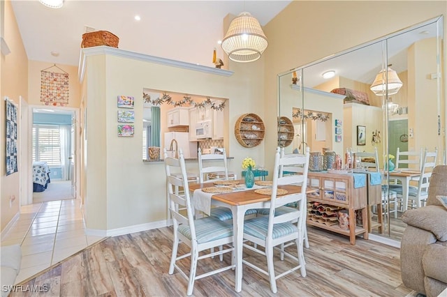 dining space with light wood-type flooring