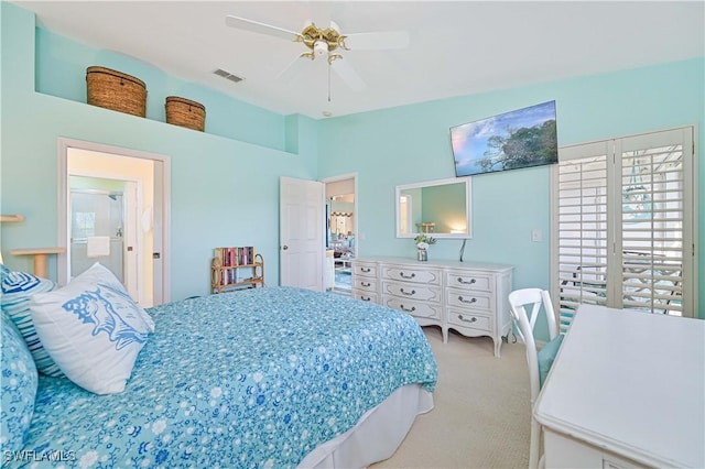 bedroom featuring ceiling fan and light carpet