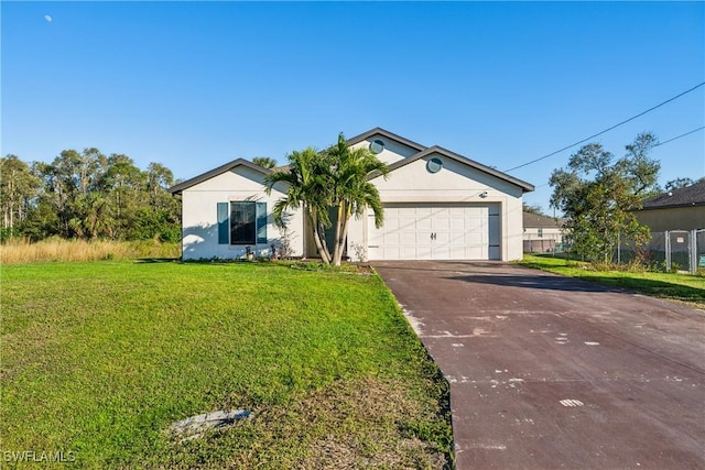 ranch-style home featuring a garage and a front lawn