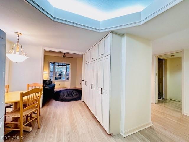 corridor with light hardwood / wood-style flooring