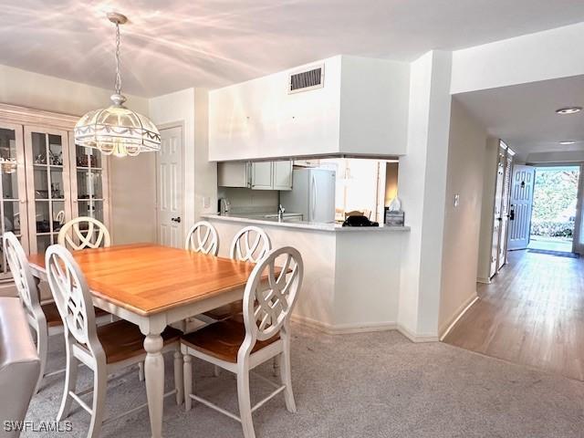 dining space with carpet floors