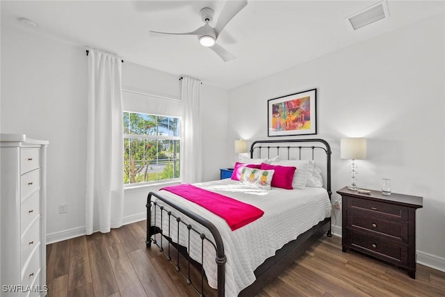 bedroom featuring ceiling fan and dark hardwood / wood-style floors