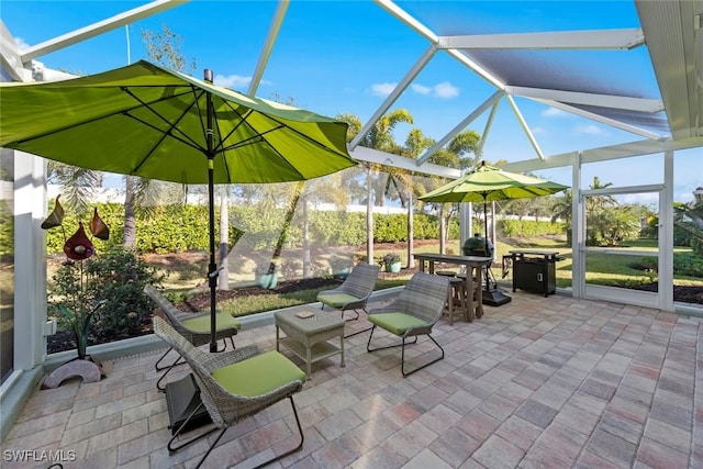 view of patio / terrace featuring a lanai