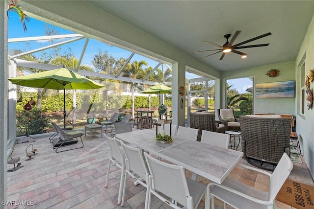 sunroom featuring ceiling fan