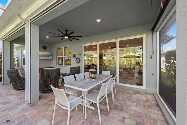 view of patio / terrace featuring ceiling fan