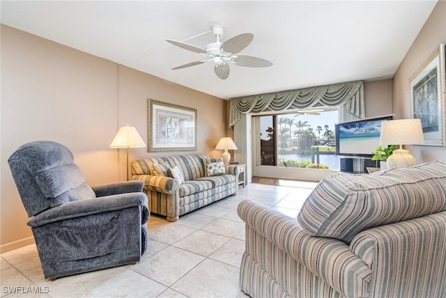 tiled living room featuring ceiling fan