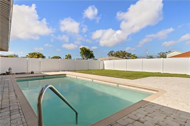 view of swimming pool featuring a patio area