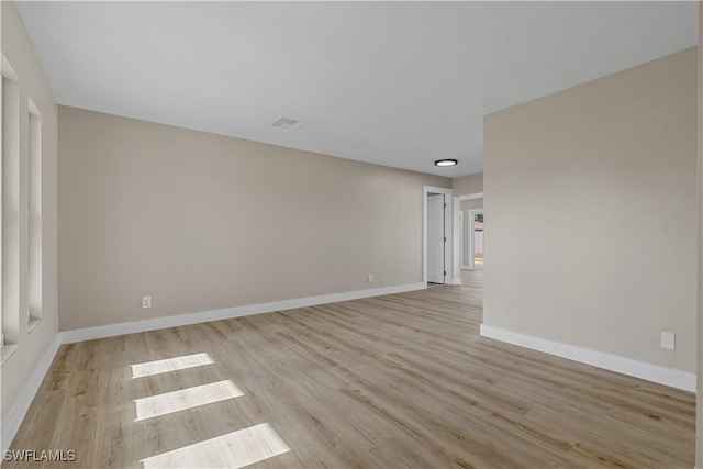 spare room with light wood-type flooring