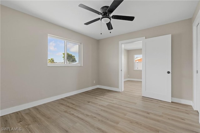 unfurnished bedroom with light wood-type flooring and ceiling fan