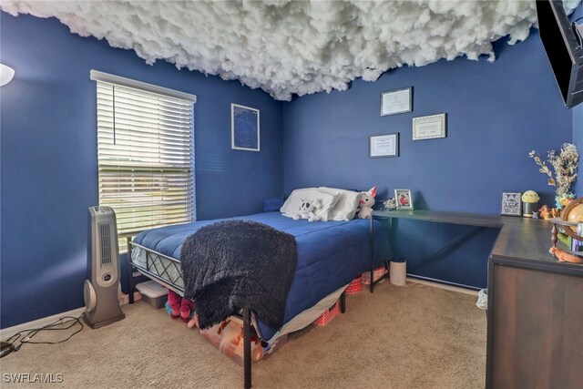 bedroom featuring light carpet