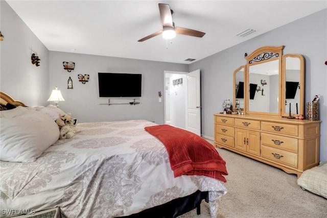 bedroom with light carpet and ceiling fan