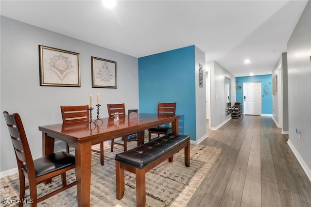 dining space featuring hardwood / wood-style flooring