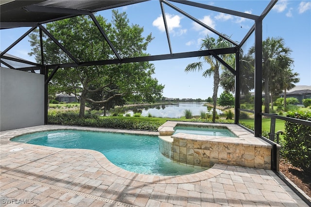 view of pool with glass enclosure, a water view, an in ground hot tub, and a patio