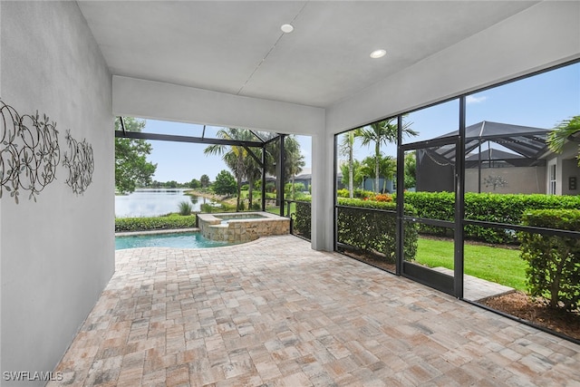 unfurnished sunroom featuring a water view