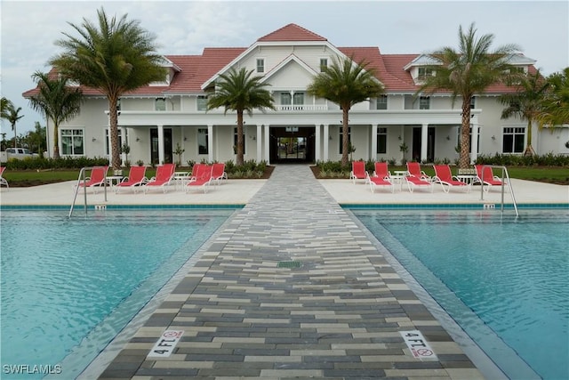 view of swimming pool featuring a patio area