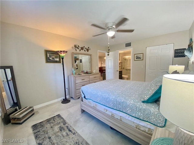 bedroom with ensuite bath and ceiling fan