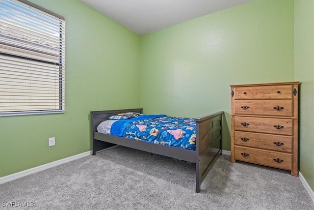 bedroom featuring light colored carpet