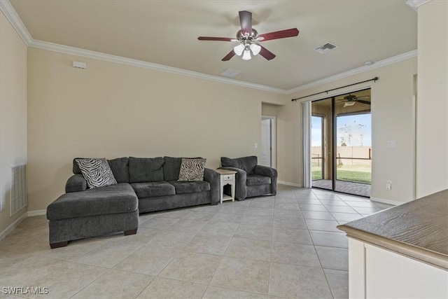 living room with light tile patterned floors and crown molding