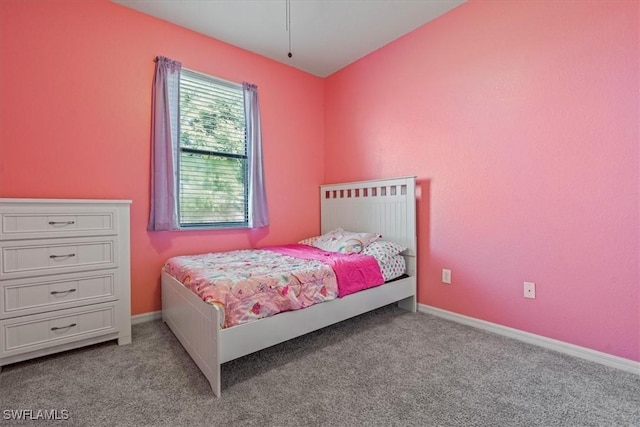 bedroom with light colored carpet