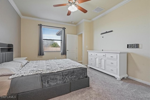 bedroom with carpet, ceiling fan, and crown molding