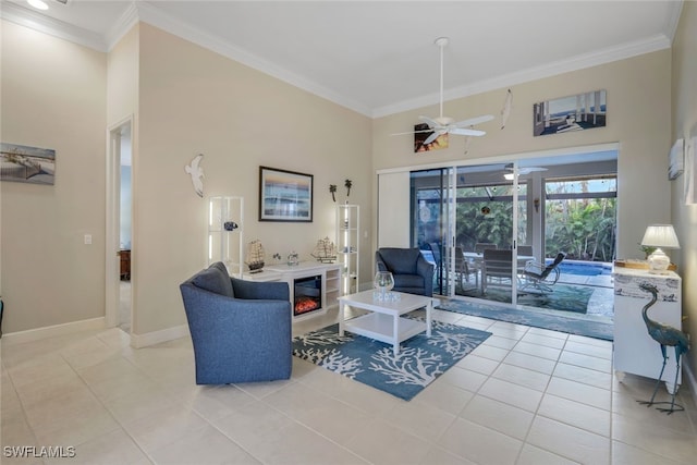 living room featuring light tile patterned floors, ceiling fan, and ornamental molding