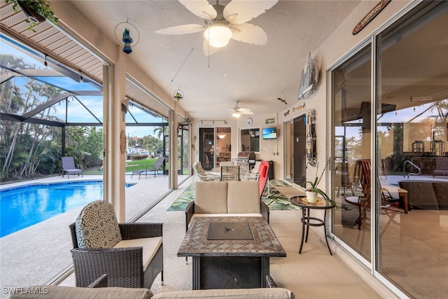 exterior space with outdoor dining area, a patio, outdoor lounge area, a ceiling fan, and a lanai