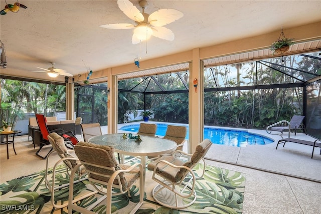 sunroom with a ceiling fan