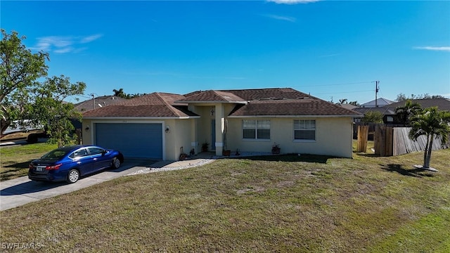 single story home featuring a front yard and a garage