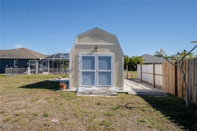 view of outbuilding featuring a lawn