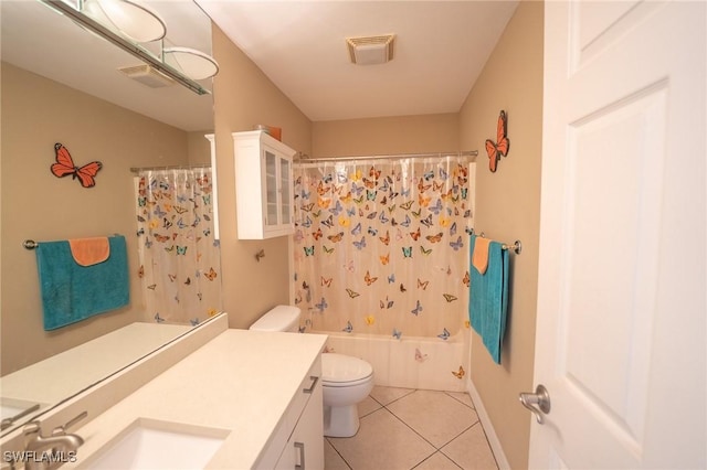 full bathroom featuring shower / bath combo with shower curtain, tile patterned flooring, vanity, and toilet