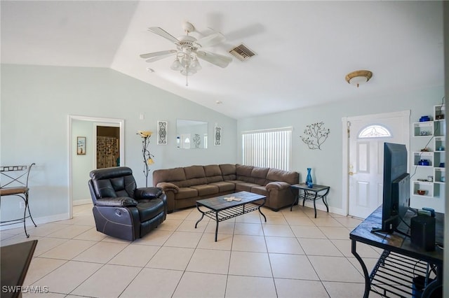 living room featuring lofted ceiling, ceiling fan, and light tile patterned floors