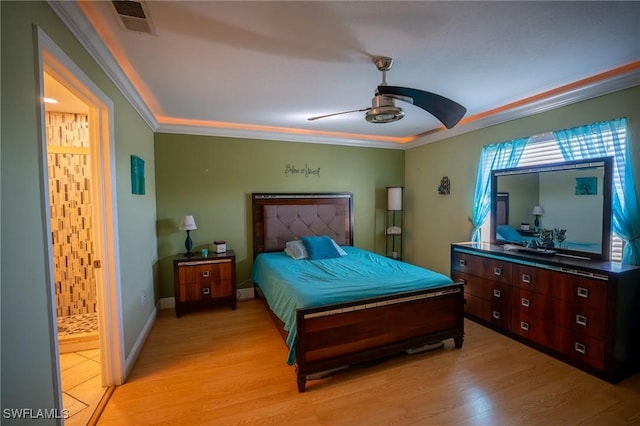 bedroom with ceiling fan, light wood-type flooring, and ornamental molding