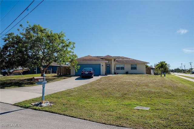 view of front of house with a front yard and a garage