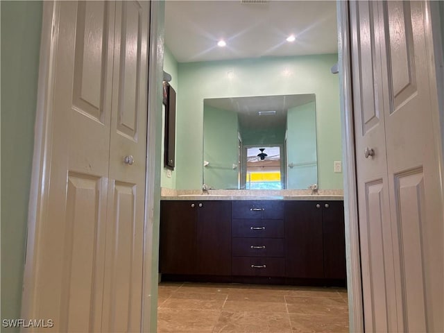 bathroom with vanity and ceiling fan