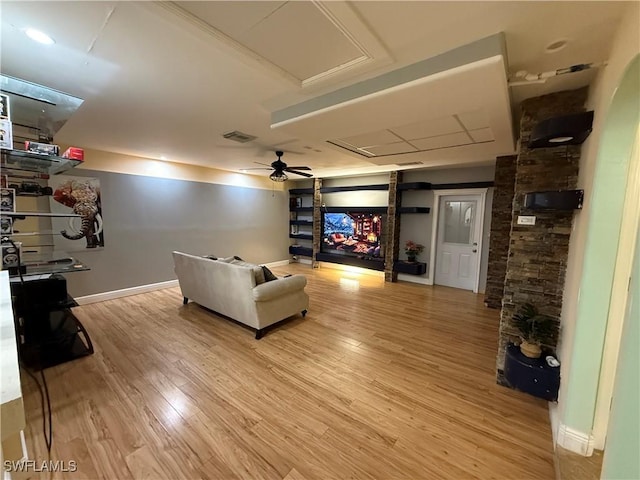 home theater featuring ceiling fan and hardwood / wood-style floors