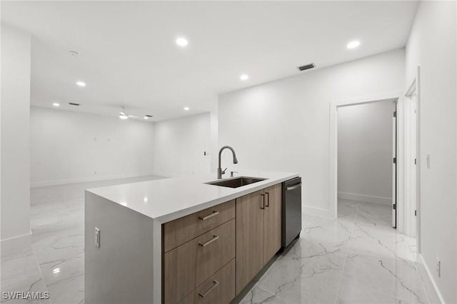 kitchen with sink, an island with sink, and stainless steel dishwasher