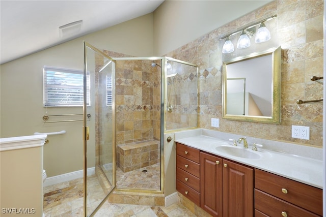 bathroom featuring vanity, toilet, and a shower with shower door