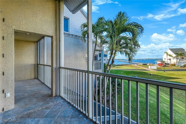 balcony featuring a water view