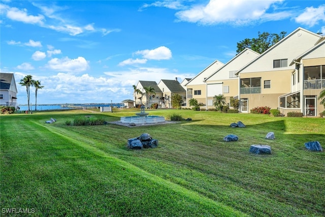 view of property's community with a lawn