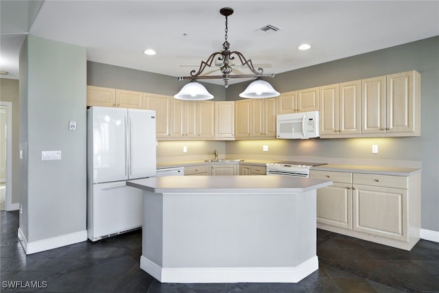 kitchen with sink, a center island, a notable chandelier, pendant lighting, and white appliances