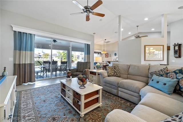 tiled living room with lofted ceiling and ceiling fan