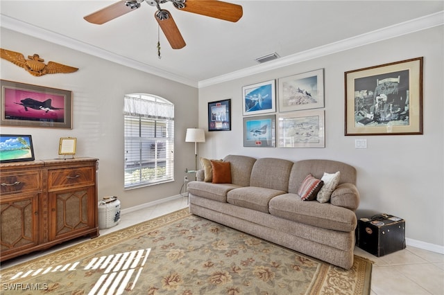 tiled living room featuring ceiling fan and crown molding