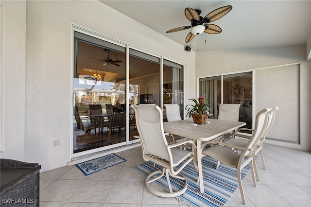 sunroom featuring ceiling fan