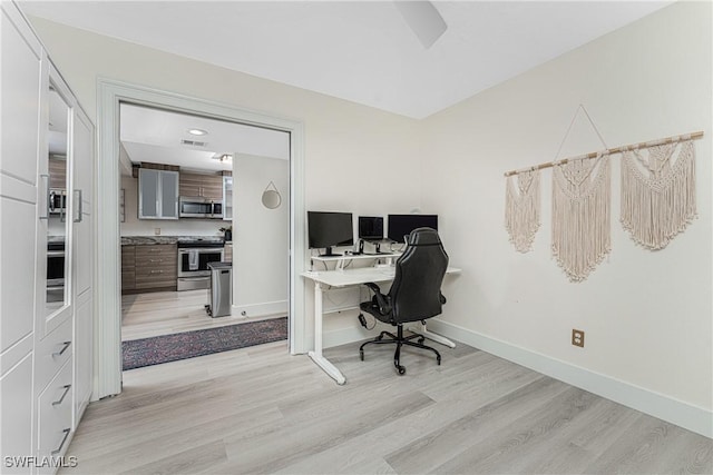 office space with light wood-type flooring