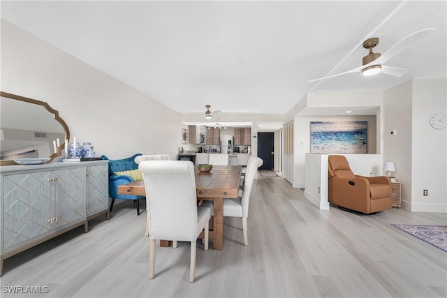 dining room featuring ceiling fan and light hardwood / wood-style flooring