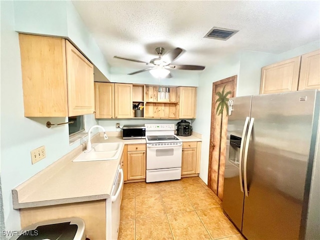 kitchen featuring sink, stainless steel refrigerator with ice dispenser, white range with electric stovetop, a textured ceiling, and light brown cabinetry